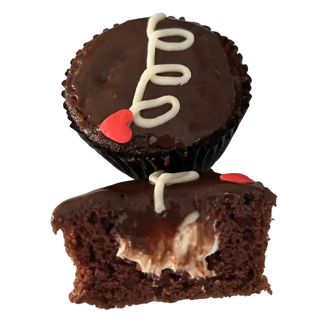 Chocolate cupcake with icing and heart decoration.